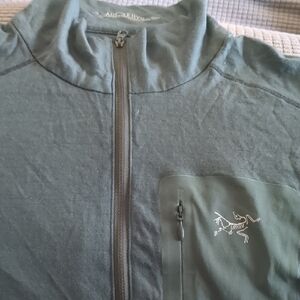 Arc'teryx blueish gray, light weight merino wool base layer.